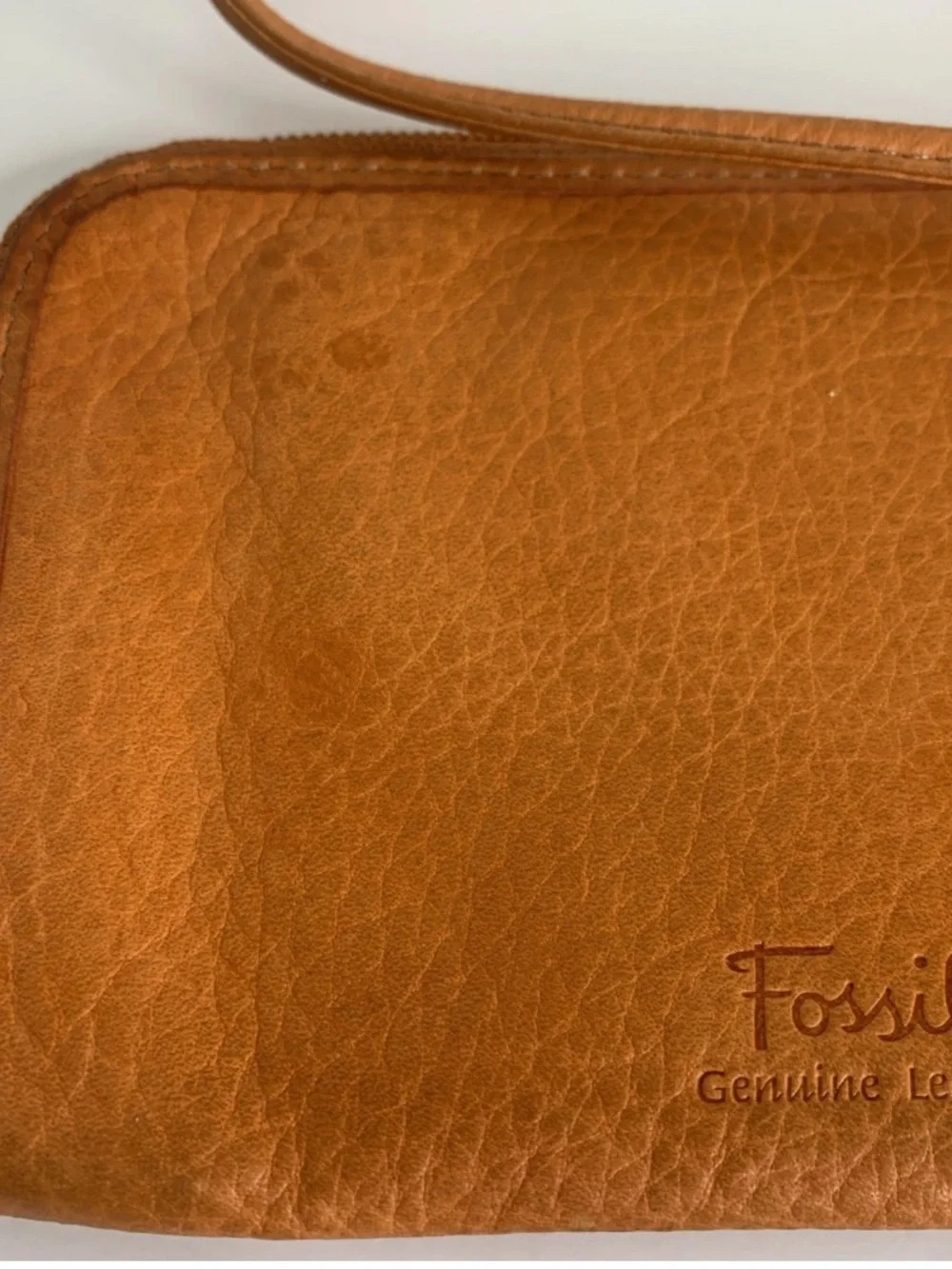 Fossil leather wristlet